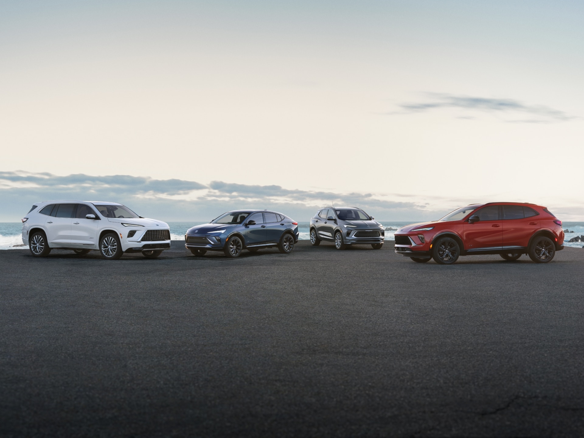 The Buick Lineup Parked Near a Body of Water on a Sunny Day